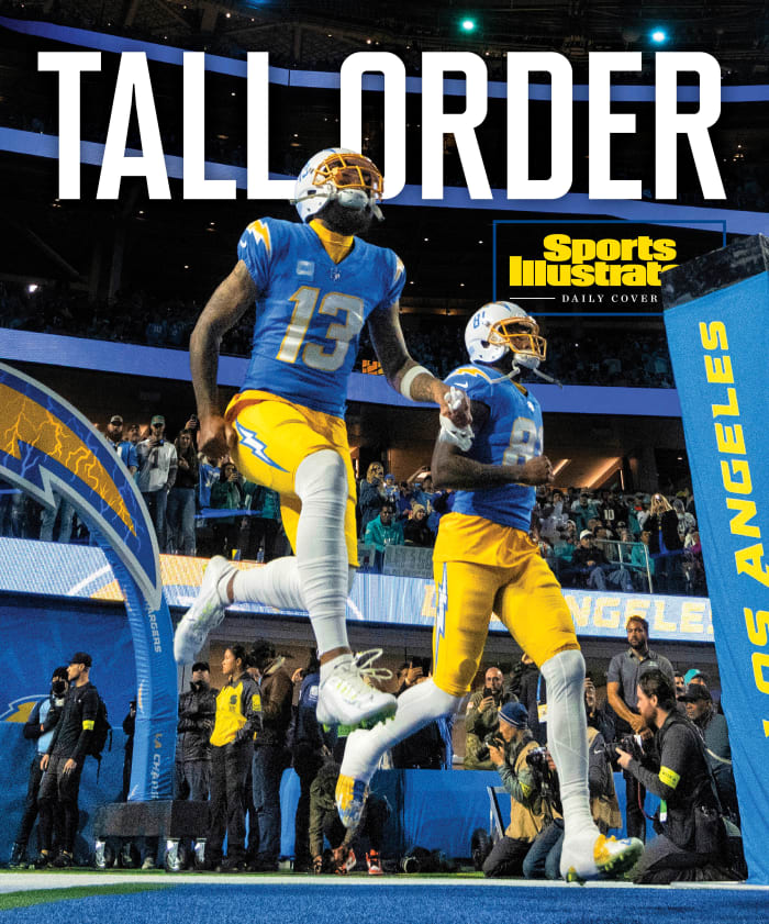 Chargers players run onto the field with the heading TALL ORDER